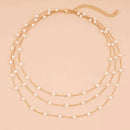 Collar Multicapa Gold Sparkling – Triple Cadena de Clavícula con Perlas