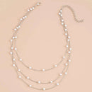 Collar Multicapa Gold Sparkling – Triple Cadena de Clavícula con Perlas